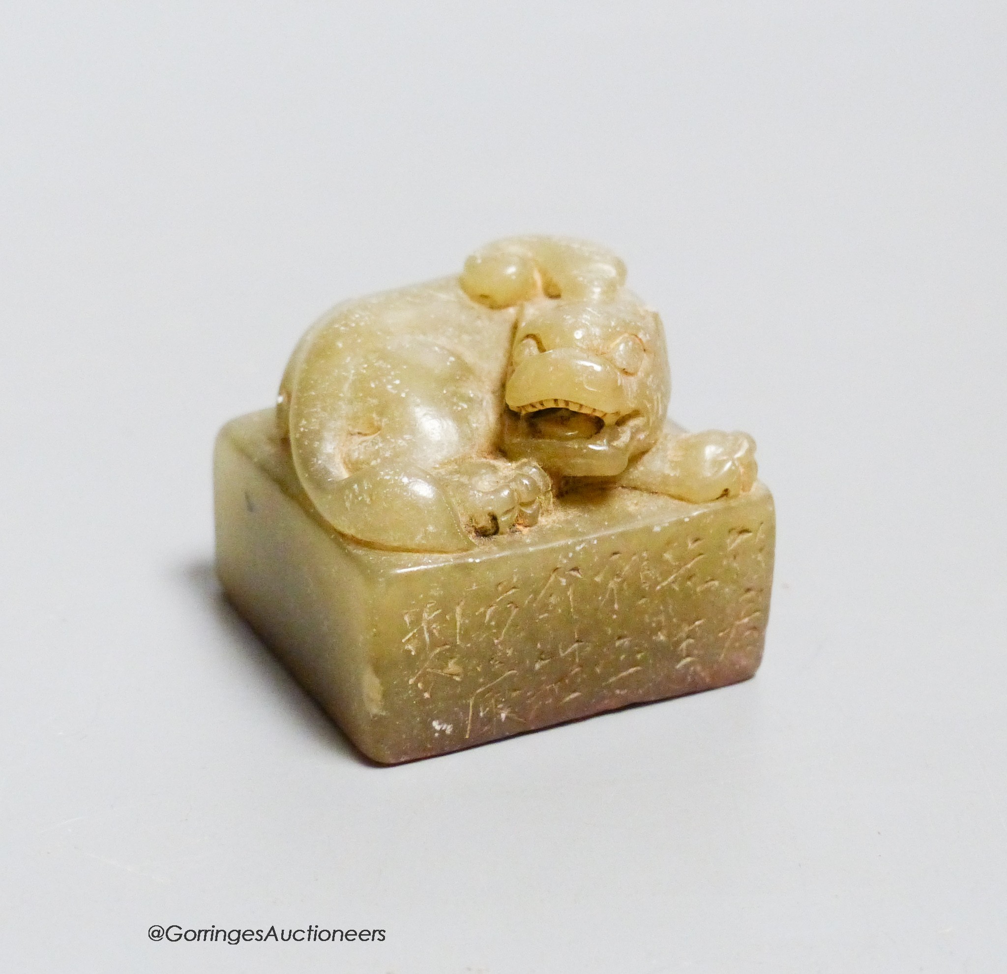 A Chinese carved soapstone 'lion-dog' seal, height 3.5cm